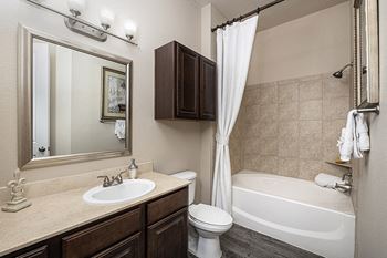 Marble bathroom vanities with custom framed mirrors